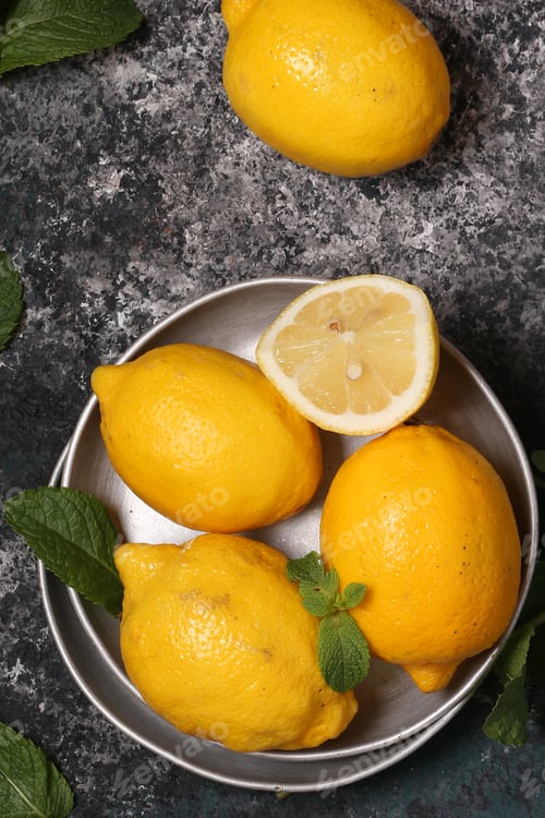 Preview: organic lemons on gray stone background