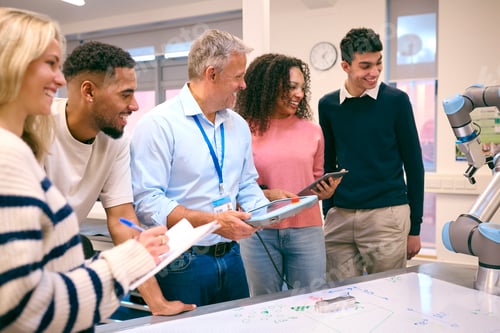Preview: Group Of College Or University Engineering Students In Robotics Class With Male Teacher