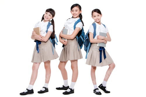 Preview: Portrait of confident schoolgirls with books and schoolbags