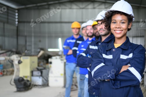 Preview: Group of confident worker team at factory