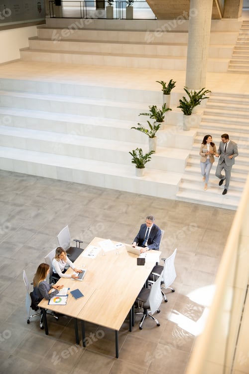 Preview: Aerial view at young startup team working in the office