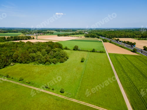 Preview: Farmland from above. Aerial view over green fields