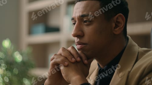 Preview: Close up face African American man ethnic thoughtful puzzled businessman pensive business