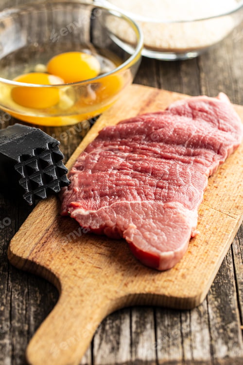 Preview: Raw veal schnitzel. Raw meat.