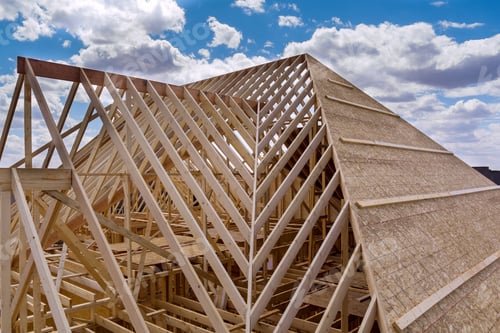 Preview: Panorama top view of closeup new wooden roof beams built home under construction under framing