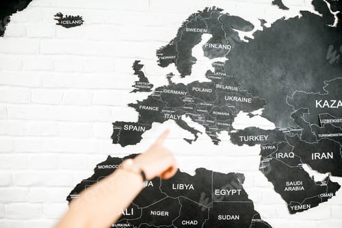 Preview: Pointing with hand on a map