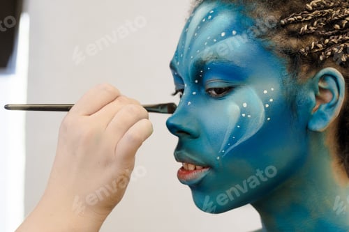 Preview: Makeup Artist applies ye shadows to a beautiful woman in Avatar style