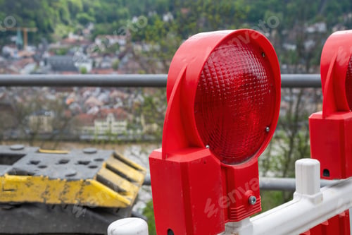 Preview: Construction safety. Street barricade with warning signal lamps on a road