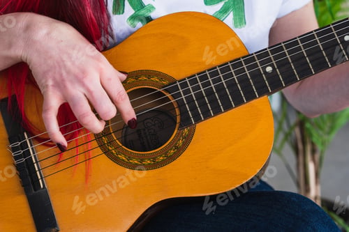 Preview: Crop woman playing Spanish guitar