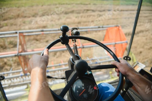 Preview: Farmer controls the combine harvester.