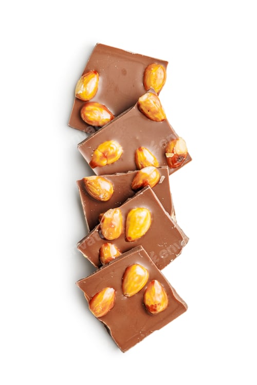 Preview: Broken chocolate bar with almonds isolated on white background.