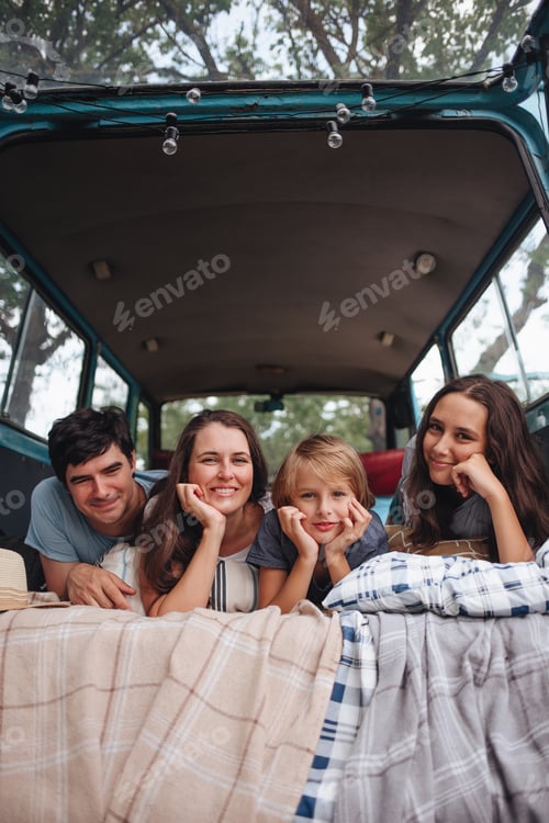 Preview: Family Enjoys Time Together Lying in Van
