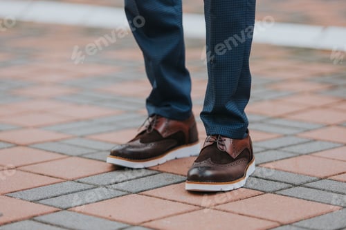 Preview: Close-up shot of a man wearing brown leather shoes