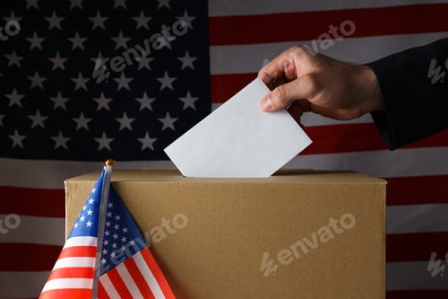 Preview: Paper voting box with paper and hand on american flag background