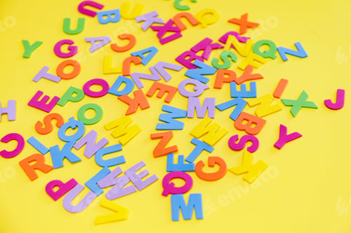 Preview: Back to school concept. Detailed plastic letters on yellow background