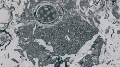 Preview: Small air bubbles rising up smooth water surface closeup. Filtered aqua waving