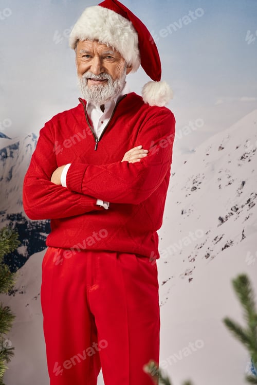 Preview: cheerful white bearded man dressed in Santa costume crossing hands smiling at camera, winter concept