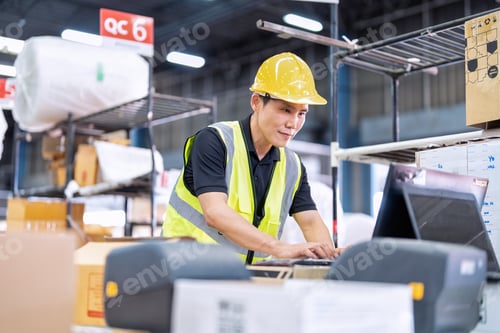 Preview: Worker working in the large depot storage warehouse happy smiling packing box at cashier counter