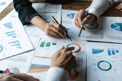 Preview: Business Professionals Reviewing Charts at an Office