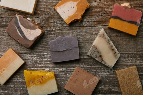 Preview: top view of handmade soap pieces on rustic wooden surface