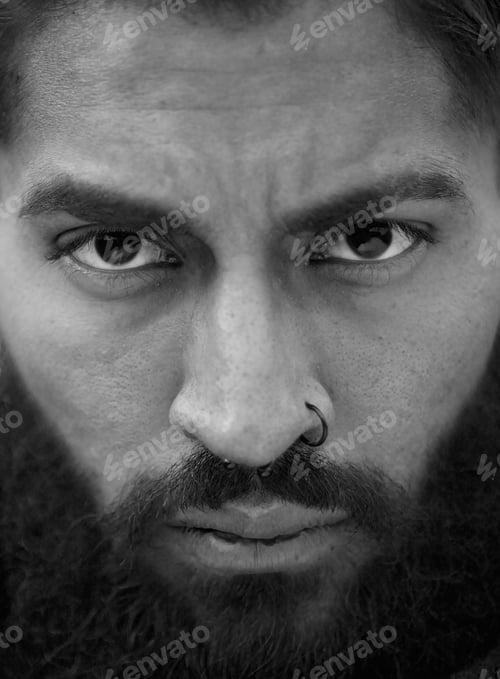 Preview: Black and white portrait of man with beard and nose piercing