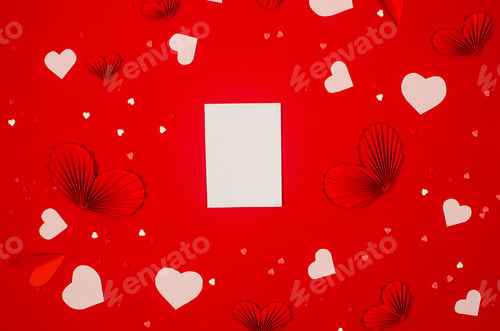 Preview: White empty blank card and various hearts on red background.