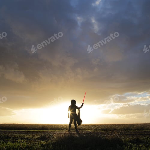Preview: Star Wars. Lightsaber. Minimal person in the storm heavy clouds shining light power