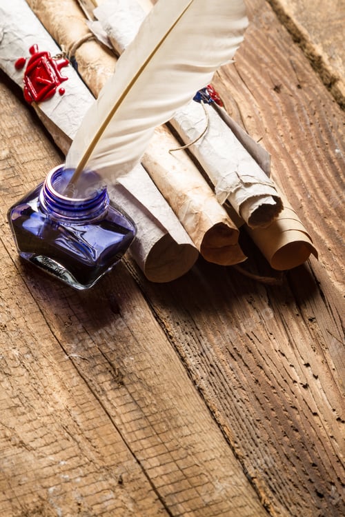 Preview: Old rolls of paper and blue ink in the inkwell