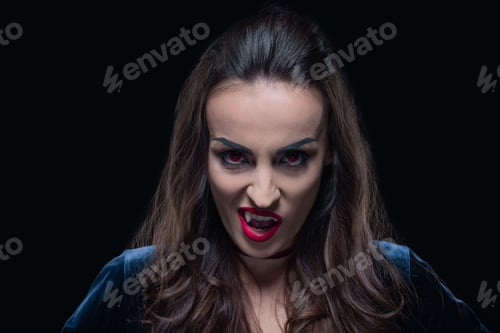 Preview: horror woman showing vampire fangs isolated on black