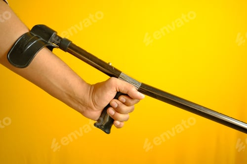 Preview: young man with broken leg on crutches.