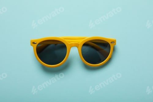 Preview: Sunglasses on a blue background, top view