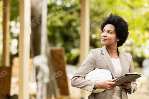 Preview: Black Woman Architect Using A Digital Tablet At Construction Site
