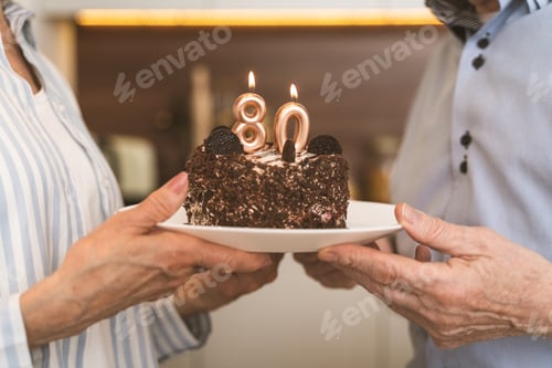 Preview: Senior couple celebrating birthday at home