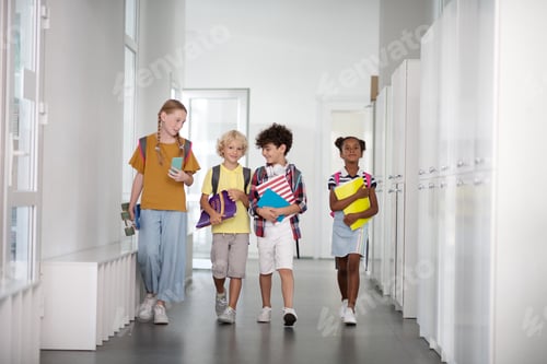 Preview: Pupils wearing backpacks waling to the classroom together