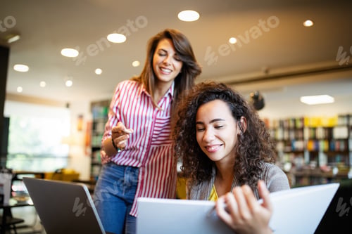 Preview: Group of students study at library. Learning and preparing for university exam