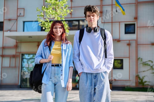 Preview: Portrait of young students guy and girl, outdoors together