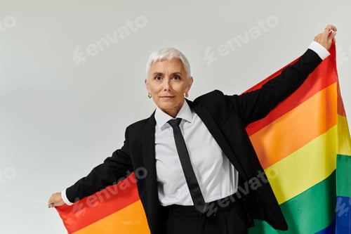 Preview: Confident Woman Celebrating Pride in Stylish Attire With Rainbow Flag