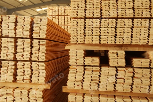 Stacked Lumber on Pallets in a Warehouse