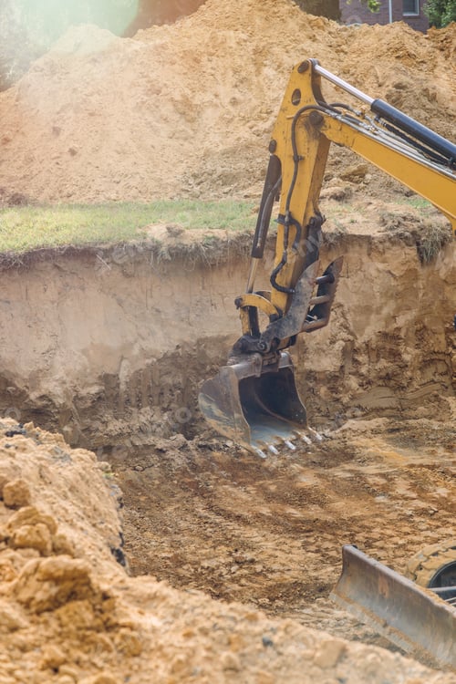 Preview: Industrial excavator in the construction of an underground foundation with family house