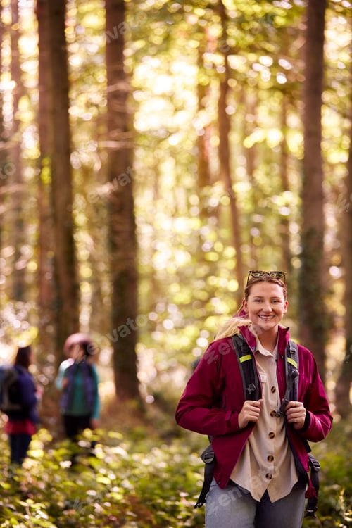 Preview: Portrait Of Woman With Group Of Female Friends On Camping Holiday Hiking In Woods Together