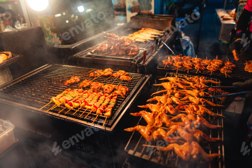 Preview: Barbecue skewers on a street side grill