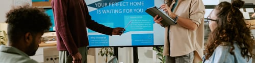Preview: Young Multiethnic Adults Discussing Real Estate Marketing Strategy in Office
