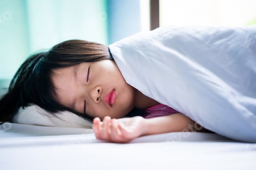 Preview: Portrait of Asian beautiful girl sleeping in white bed. Baby sleeping in blanket.
