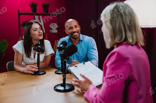 Preview: Content creators recording a podcast interview in studio