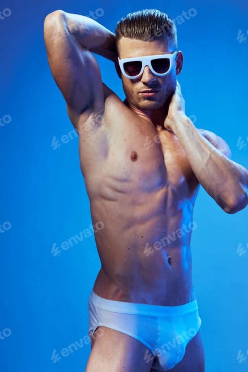 Preview: athletic man with a pumped-up body in dark glasses bodybuilders