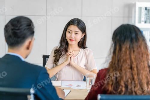 Preview: Young Asian woman graduate interviewing with two manager with positive motion