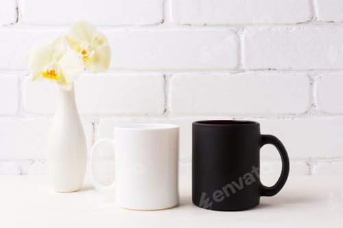 Preview: White and black mug mockup with soft yellow orchid in vase