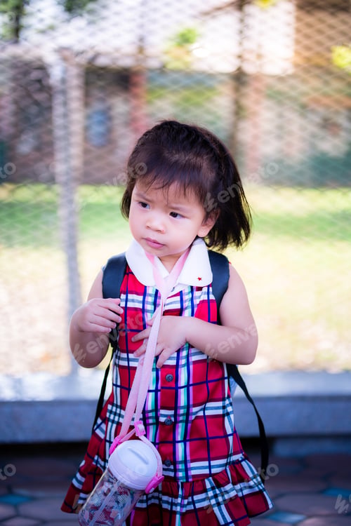 Preview: Portrait of Asian baby girl. Upset face child. Vertical image.