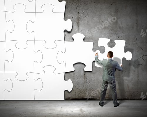 Preview: Image Of Businessman Compiling Macro White Puzzle. Building Business
