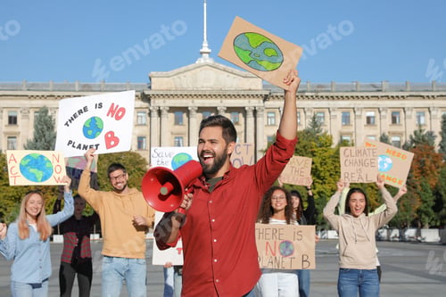 Preview: Group of people with posters protesting against climate change on city street